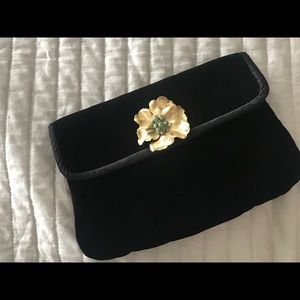 Black velvet clutch with vintage brooch